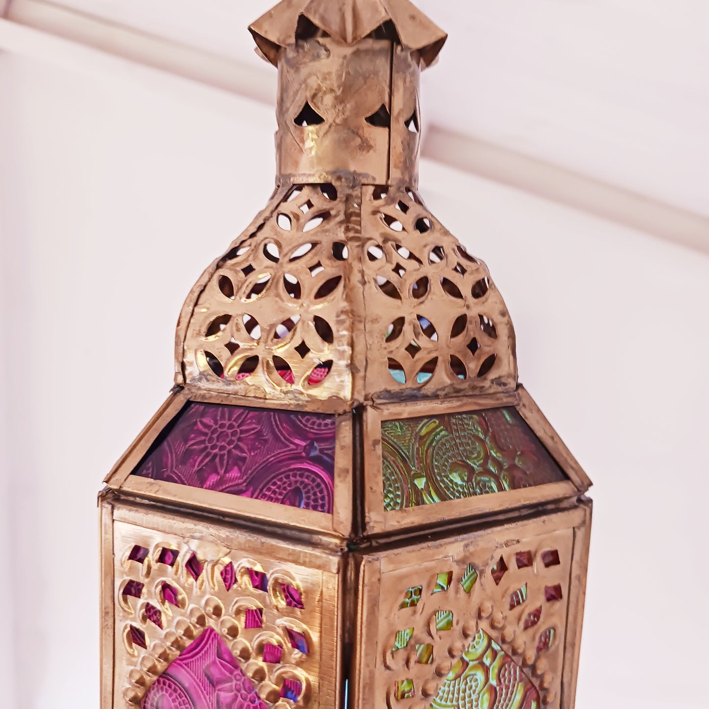 These stunning hanging tealight lanterns feature a rich combination of embossed coloured glass against intricate metal crafted design. Add a warming touch to evenings and enjoy the soothing ambience of natural light against lustrous colour. Super for entertaining inside or out, this gorgeous creation is sure to be a conversation booster!