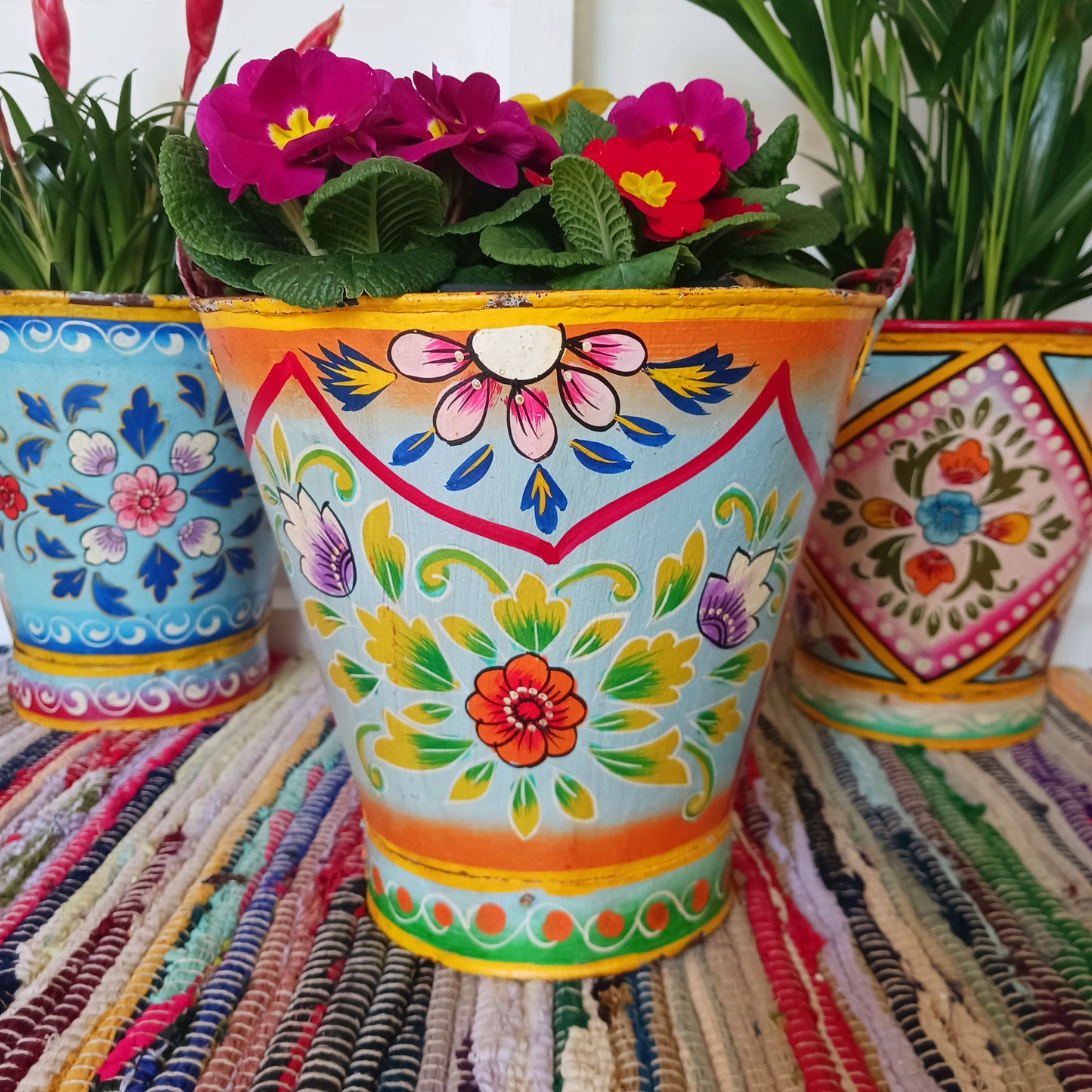Hand painted in a blue floral design, a vintage style iron plant pot to display as a decorative indoor/outdoor planter.
Lovingly hand painted by skilled artisans on a fair trade basis in the Indian desert city of Jodhpur. Fill the striking container with a flowering or contrasting potted plant. Grow seasonal bulbs to bring life and inspiration.