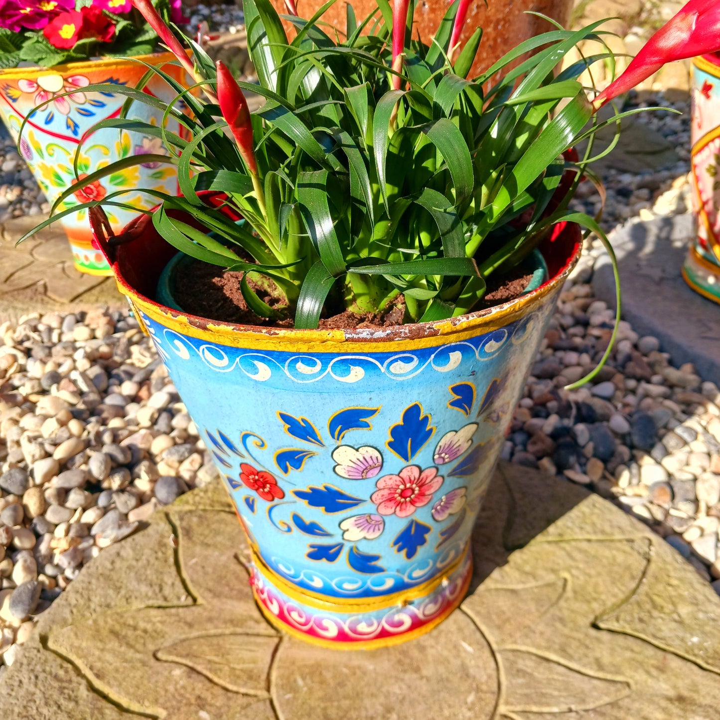 Hand painted in a blue floral design, a vintage style iron plant pot to display as a decorative indoor/outdoor planter.
Lovingly hand painted by skilled artisans on a fair trade basis in the Indian desert city of Jodhpur. Fill the striking container with a flowering or contrasting potted plant. Grow seasonal bulbs to bring life and inspiration.