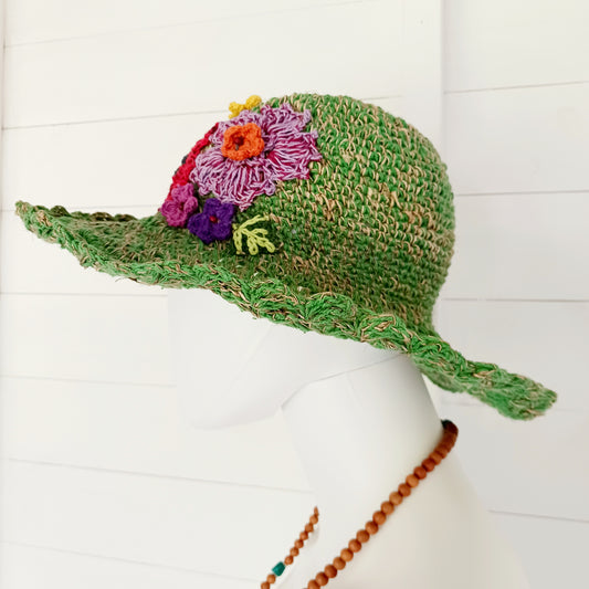 Hand-knitted Hemp & Cotton Boho Festival Hat with Rainbow band. A unique accessory that beautifully embodies the free-spirited essence of Bohemian style. Handcrafted with care, each of these hats is a harmonious blend of hemp and cotton, resulting in a distinctive piece that exudes both fashion and sustainability. They're ideal for music festivals, beach outings, or simply just to brighten up any outfit.