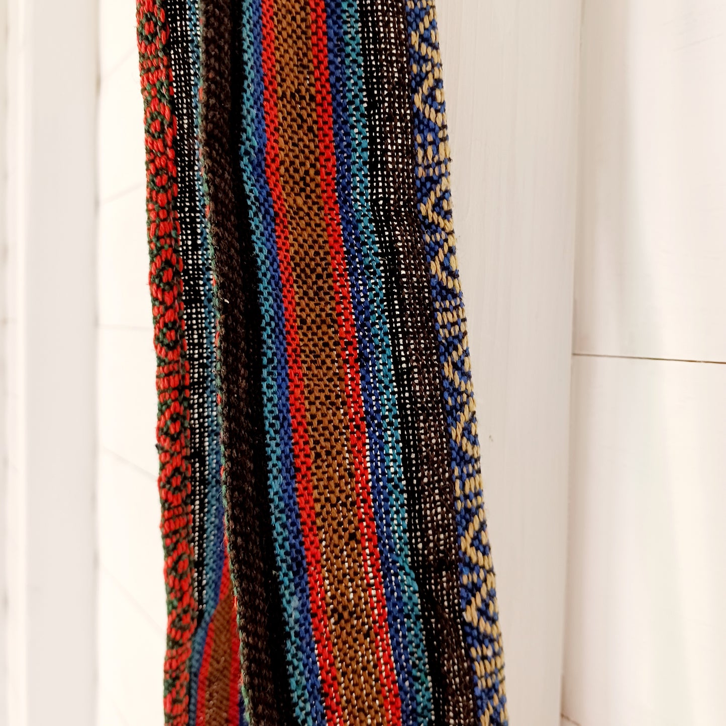 his handy little shoulder bag has a wide strap that is long enough to use as a shoulder or crossbody bag and also makes it comfortable to wear for long periods. The main fabric is traditional with a beautiful embroidered elephant design on the front. The bag is finished with tassels.