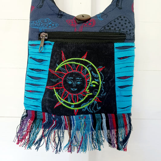 This lovely Sun & Moon shoulder bag is perfect for your next festival, travel trip or the beach. This cute handy passport bag is a great lightweight bag that can be worn as either a shoulder or crossbody bag.