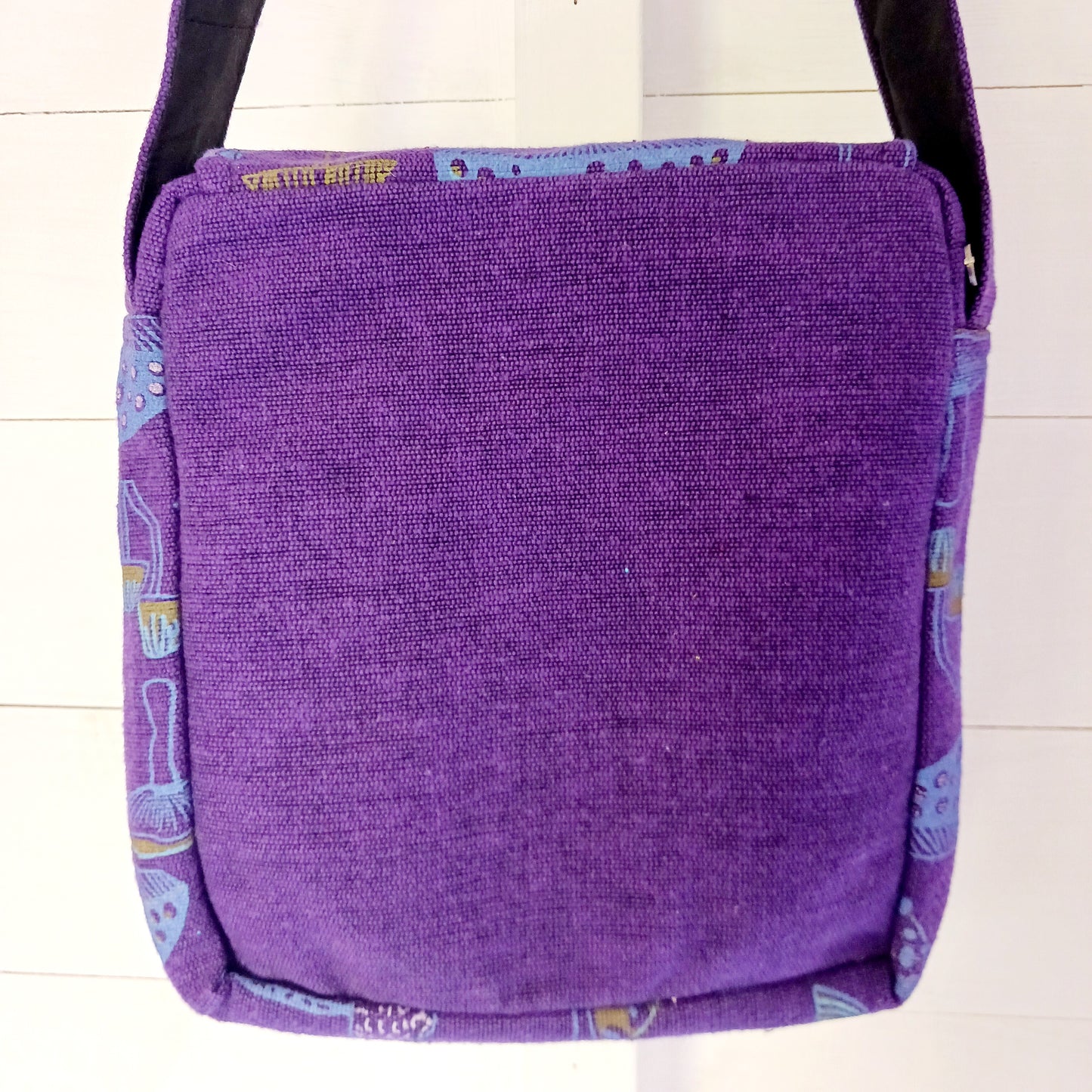 This lovely Yin Yang shoulder bag is both practical and unusual. There are three zipped compartments ensuring you keep your valuables safe. The Yin Yang design on the front is set in a colourful mandala on the flap, and this is secured with a velcro strips. The staps are adjustable to suit your style.