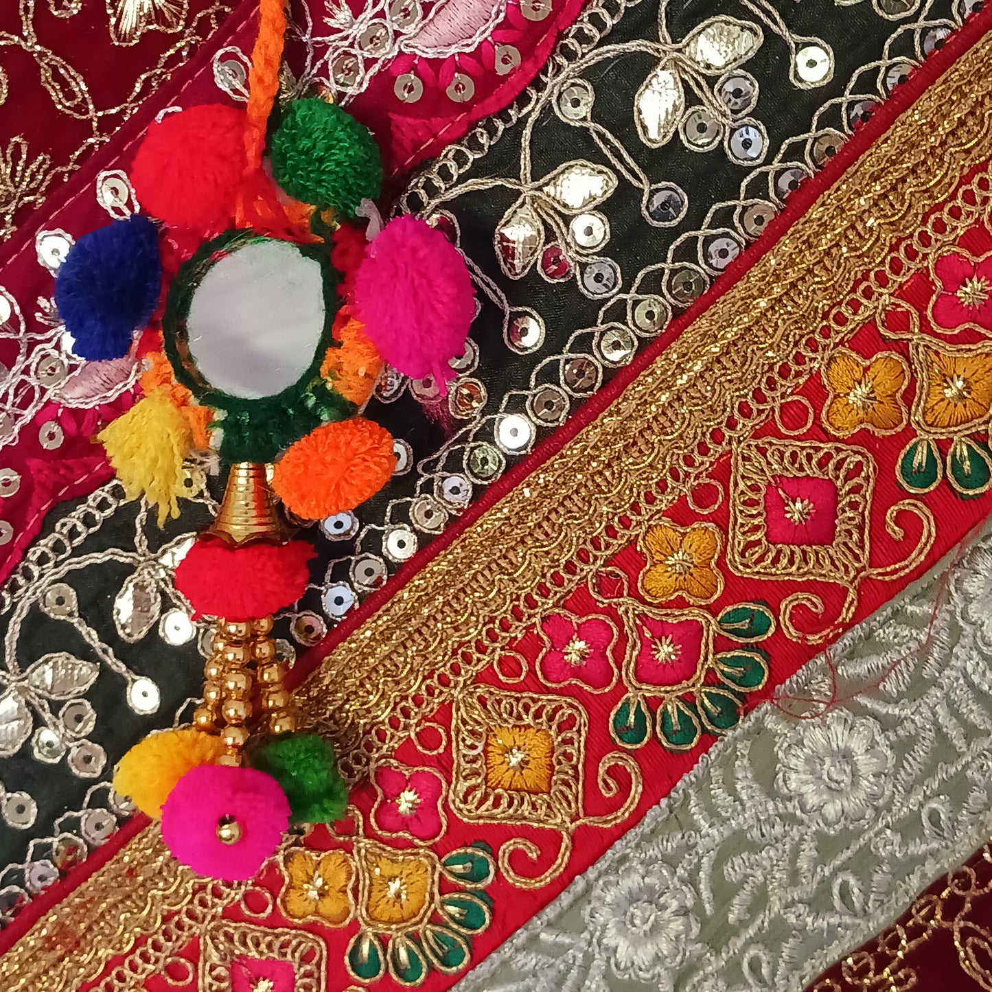 This beautiful large Indian bag comes with a wide shoulder strap and plenty of space inside for your personal items. In a patchwork style design, this bag is intricately embroidered with a traditional bohemian pattern. The bag is fully lined throughout.