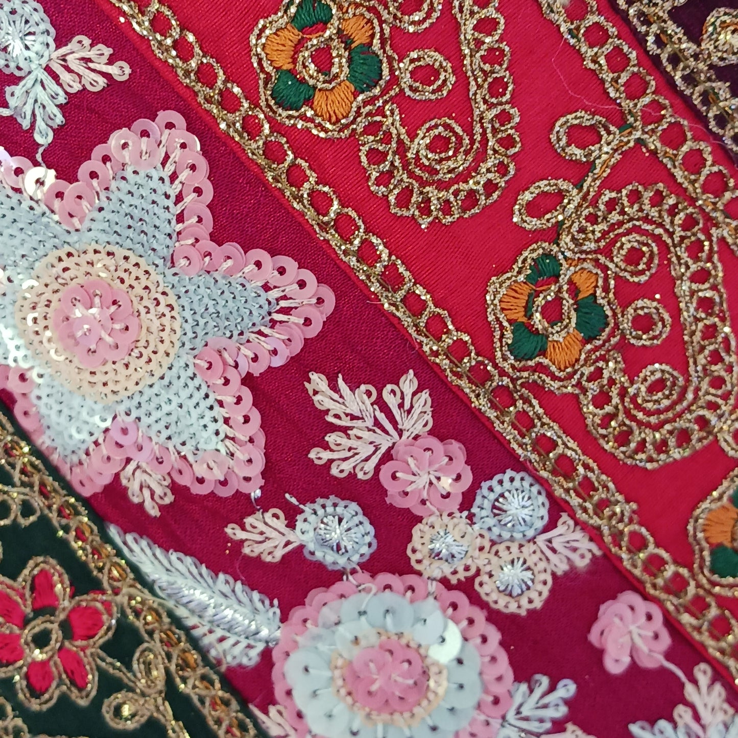 This beautiful large Indian bag comes with a wide shoulder strap and plenty of space inside for your personal items. In a patchwork style design, this bag is intricately embroidered with a traditional bohemian pattern. The bag is fully lined throughout.