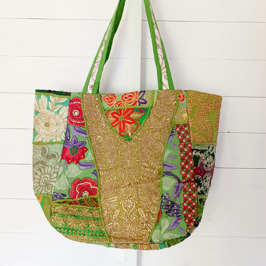 This beautiful large Indian bag comes with a wide shoulder strap and plenty of space inside for your personal items. In a patchwork style design, this bag is intricately embroidered with a traditional bohemian pattern. The bag is fully lined throughout.