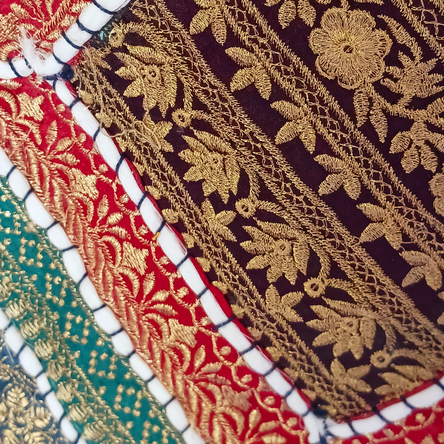 This beautiful large Indian tote bag comes with a wide shoulder strap and plenty of space inside for your personal items. In a patchwork style design, this bag is intricately embroidered with a traditional bohemian pattern. The bag comes decorated with beads and pom poms and is fully lined throughout.