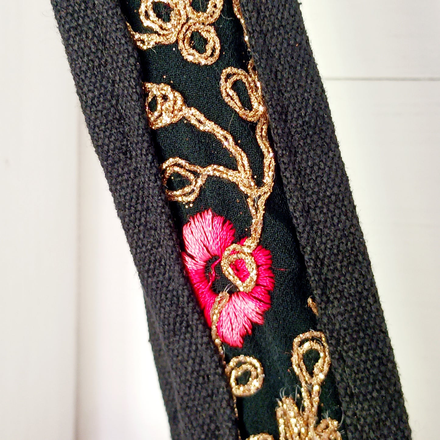 This beautiful large Indian tote bag comes with a wide shoulder strap and plenty of space inside for your personal items. In a patchwork style design, this bag is intricately embroidered with a traditional bohemian pattern.The bag comes decorated with beads and pom poms and is fully lined throughout.
