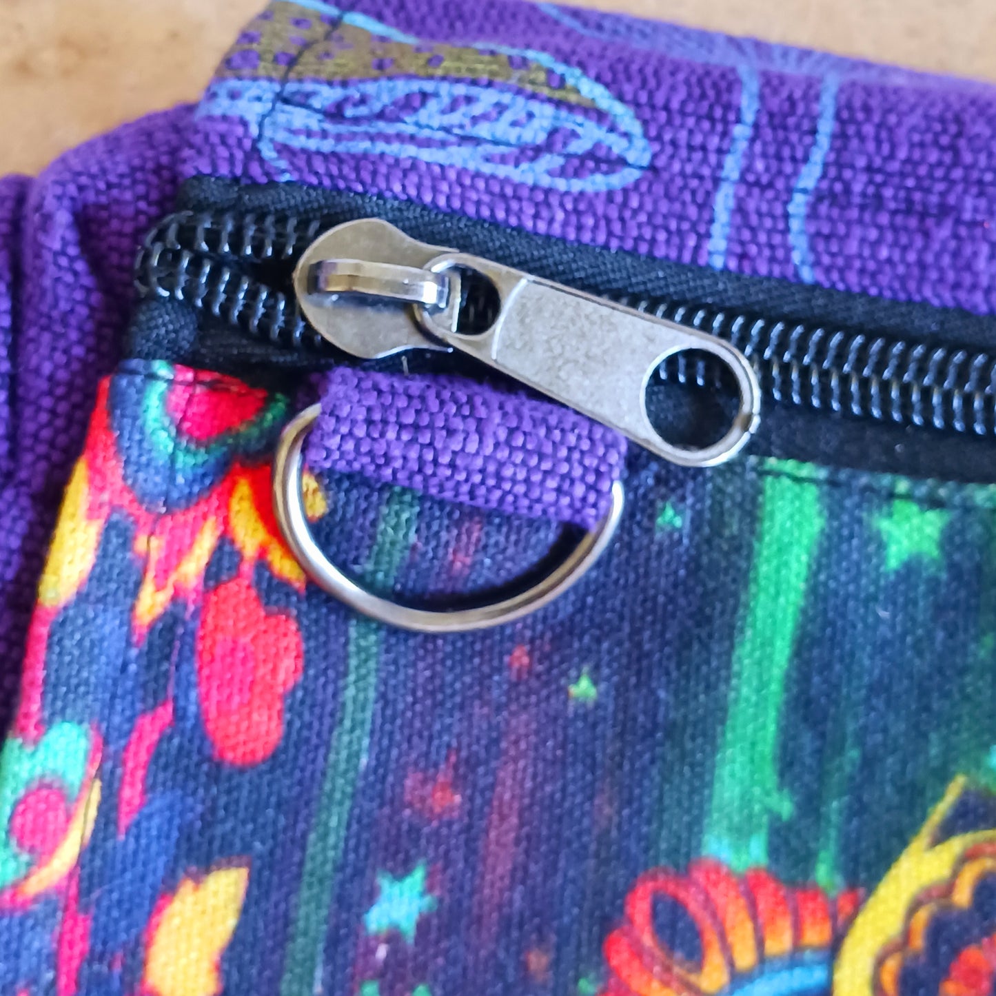 This lovely Yin Yang shoulder bag is both practical and unusual. There are three zipped compartments ensuring you keep your valuables safe. The Yin Yang design on the front is set in a colourful mandala on the flap, and this is secured with a velcro strips. The staps are adjustable to suit your style.