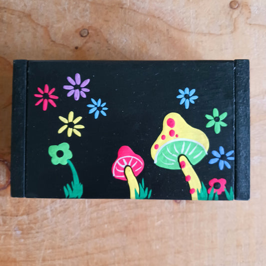 Add a touch of woodland magic to your space with this beautifully hand painted mushroom trinket box. Featuring a vibrant mushroom and toadstool design, this charming little keepsake box is perfect for storing your treasured jewellery, crystals, rings, or small trinkets.
