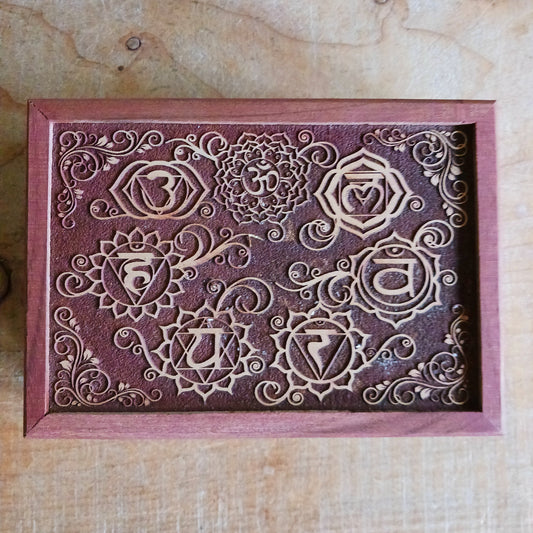 Celebrate the elegance of hand-carved craftsmanship with this Wooden Keepsake Box Om, made from sustainably sourced mango wood in India.