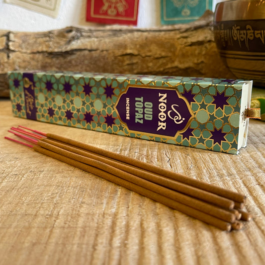 Awaken your senses with Noor Oud Topaz Incense, a divine blend from the Noor Collection inspired by the sacred traditions of the Middle East. This luxurious incense captures the essence of Oudh, one of the world’s most revered aromatic resins, infused with saffron, patchouli, and sandalwood for a rich and harmonious fragrance.
Each stick releases a deep, warm, and meditative aroma, perfect for rituals, relaxation, or elevating your spiritual practice. The blend of earthy patchouli and golden saffron notes