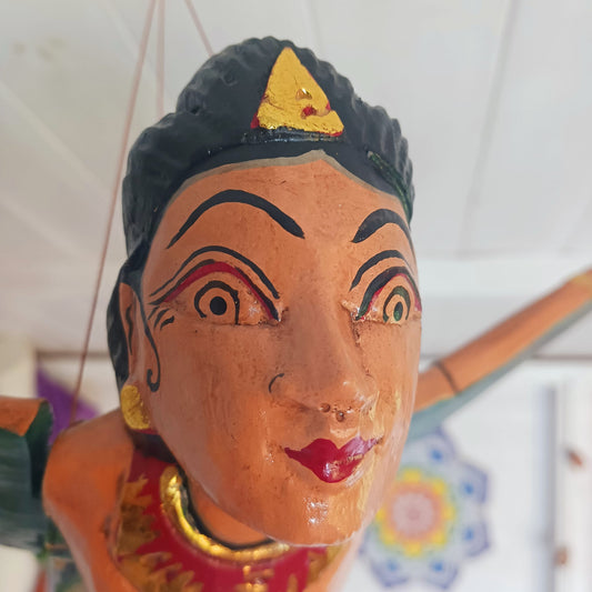 Bring a touch of the exotic to your home with this beautiful Flying Dewi Sri Lady Mobile. Hand-crafted in Bali, it features rich colours, gold detailing and a strong twine for easy hanging.