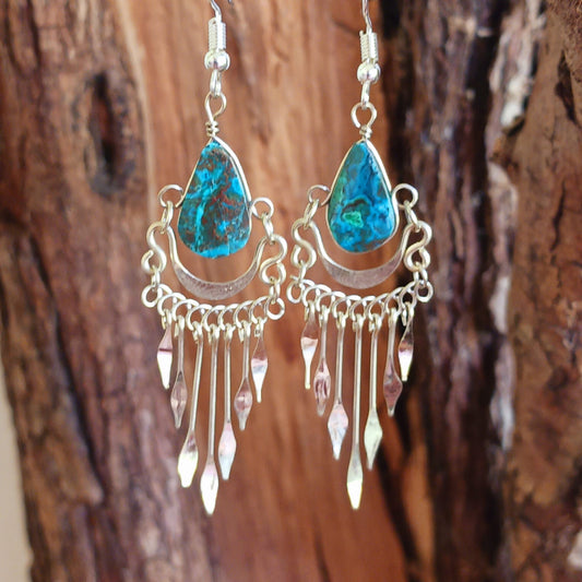 These beautiful earrings incorporate a dark turquoise stone with Silver plated hooks. These earrings have been hand made and are presented in a traditionally made pouch gift wrapped and ready to give ☸