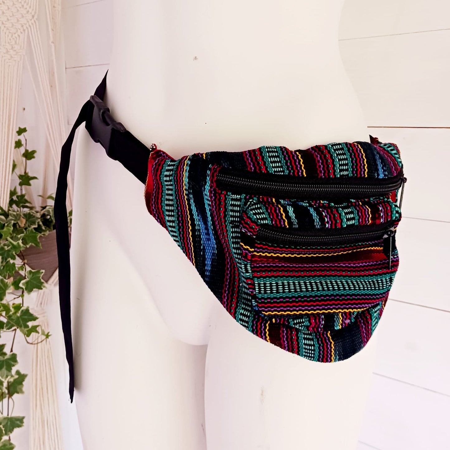 A festival favourite, these funky cotton Guatemalan bum bags come in mixed patterns. Each hip bag has three zipped compartments for organizing your valuables and a long adjustable belt strap with clasp. Perfect for holidays, the beach and festivals. Handmade and Fairtrade from Guatemala