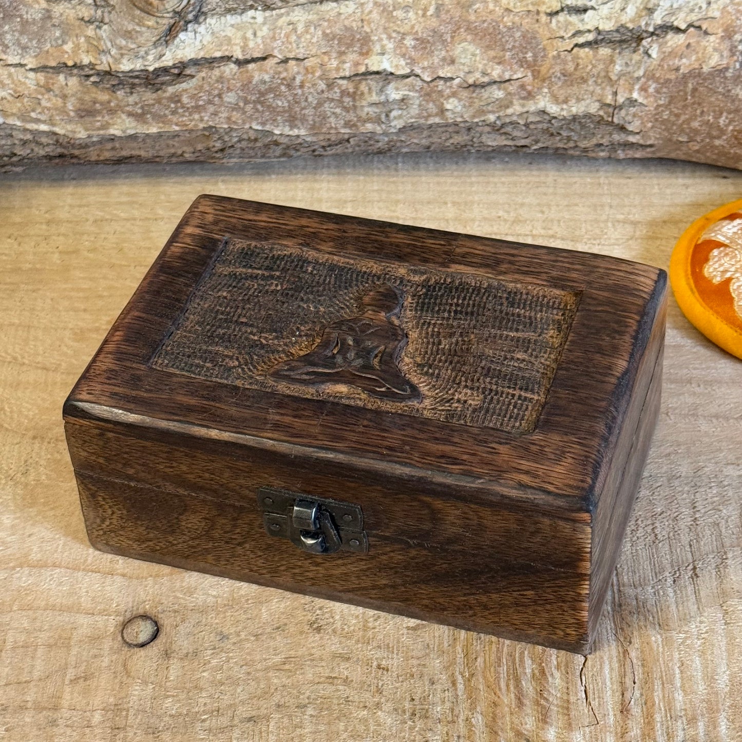 Square Wooden Keepsake Box - Buddha
Discover the beauty of handcrafted artistry with this lovely mango wood box, hand-carved in India. Perfect for storing trinkets, jewelry, and cherished keepsakes, this box combines charm and functionality with its unique design and sturdy construction.
✨ Features:
Made from sustainably sourced mango wood
Hand-carved craftsmanship from India
Secure brass fastening at the front
Approximate size: 15 x 10 x 6 cm
Each box is unique, making it a thoughtful gift or a beautif