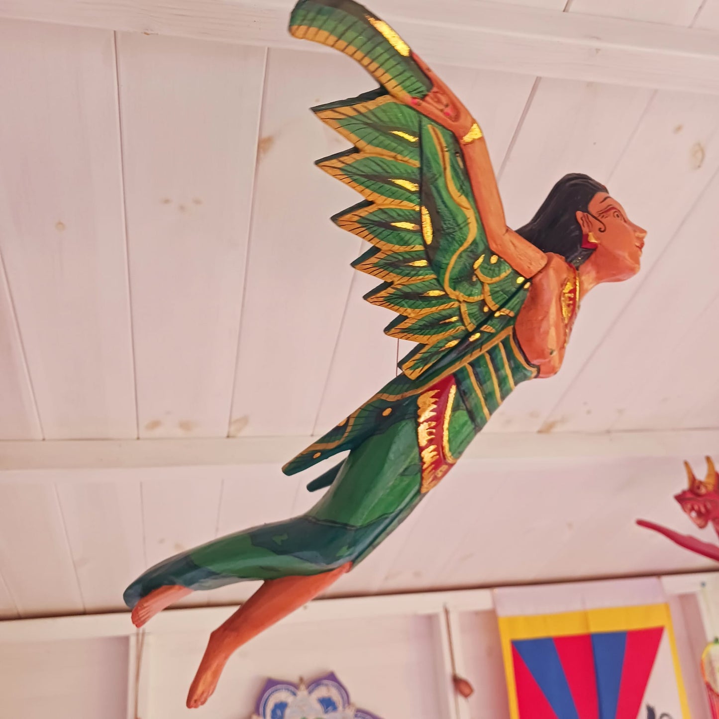 Bring a touch of the exotic to your home with this beautiful Flying Dewi Sri Lady Mobile. Hand-crafted in Bali, it features rich colours, gold detailing and a strong twine for easy hanging.