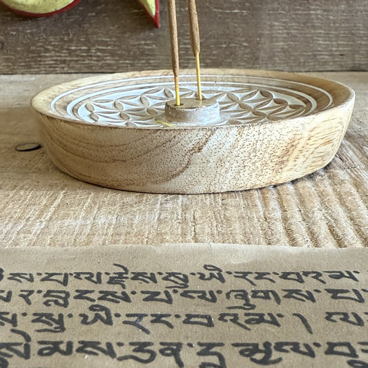 Invite harmony and sacred stillness into your home with this beautifully hand-carved Flower of Life Incense Burner, made from sustainable mango wood. Each piece is crafted with care, featuring the intricate Flower of Life — a sacred geometry pattern symbolizing the interconnectedness of all living things.