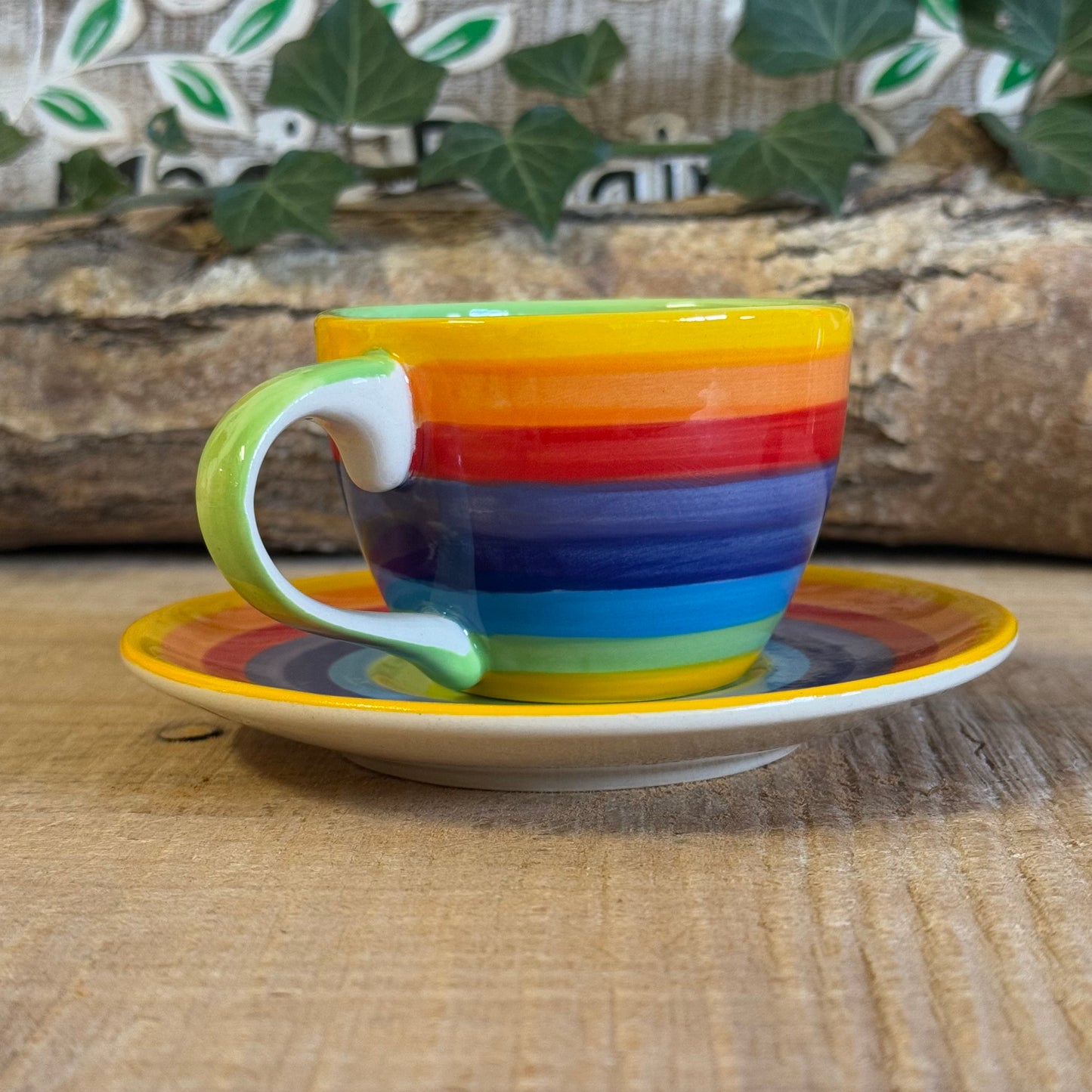 Enjoy your coffee in style with our handmade rainbow stripe ceramic cup & saucer. Fair-trade from Thailand, this vibrant, hand-painted set is dishwasher and microwave safe—perfect for brightening up any home.