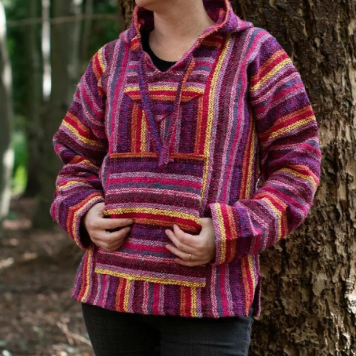 Mexican Jergas or Baja tops are very practical hooded outwear made from a cotton acrylic blend which gives them a durable rustic exterior with a soft, cosy brush interior.
The weave of the fabric makes the Baja both breathable and warm and therefore a firm favourite for festivalgoers and people involved in outdoor sporting activities. The tops are great for cool summer evenings and are available in sizes generous enough to wear with multiple layers underneath.