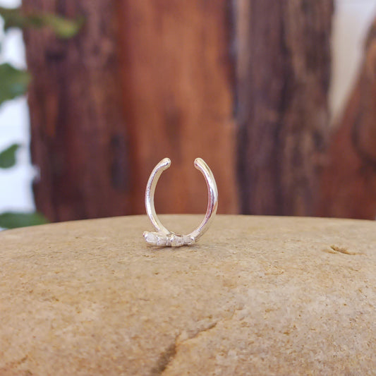 Beautiful and dainty weed leaf silver ear cuff. No piercing is needed to wear, it can be easily adjusted to hug your ear cartilage. Perfect for anyone who doesn't have pierced ears or if you just want to add to your Hippie look.