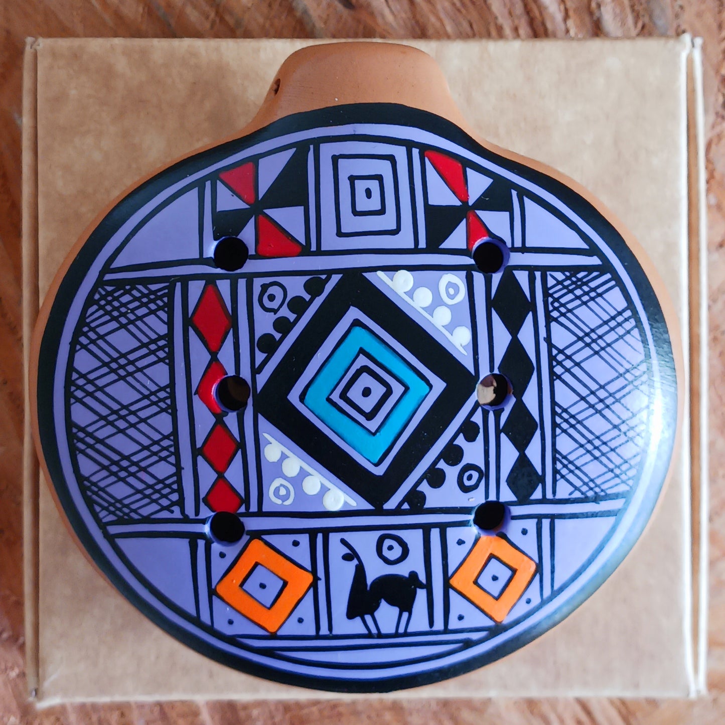 Experience the timeless sound of ancient cultures with these gorgeous ocarinas, handcrafted from fired clay in Peru. Adorned with vibrant, traditional designs, they are a favourite among musicians.