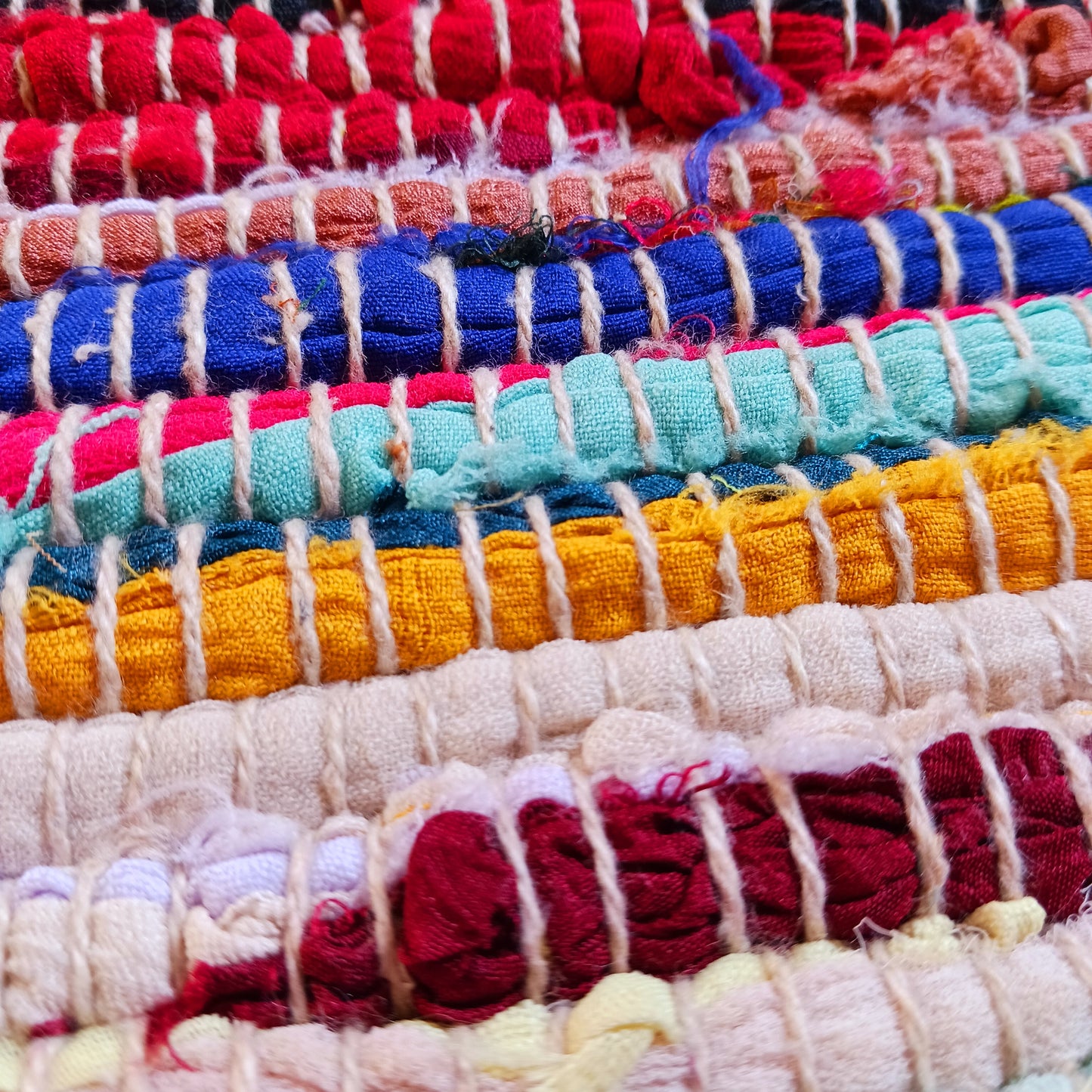 An Indian classic, this multi-coloured cotton and viscose striped rag rug is made from recycled materials and is machine-washable.