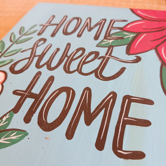 Add warmth and personality to your home with this beautiful Hand Painted Home Sweet Home Wall Plaque. Featuring a vibrant, colourful design and carefully hand-painted finish, this decorative wall plaque is a charming addition to any living room, hallway, kitchen, or entrance.
