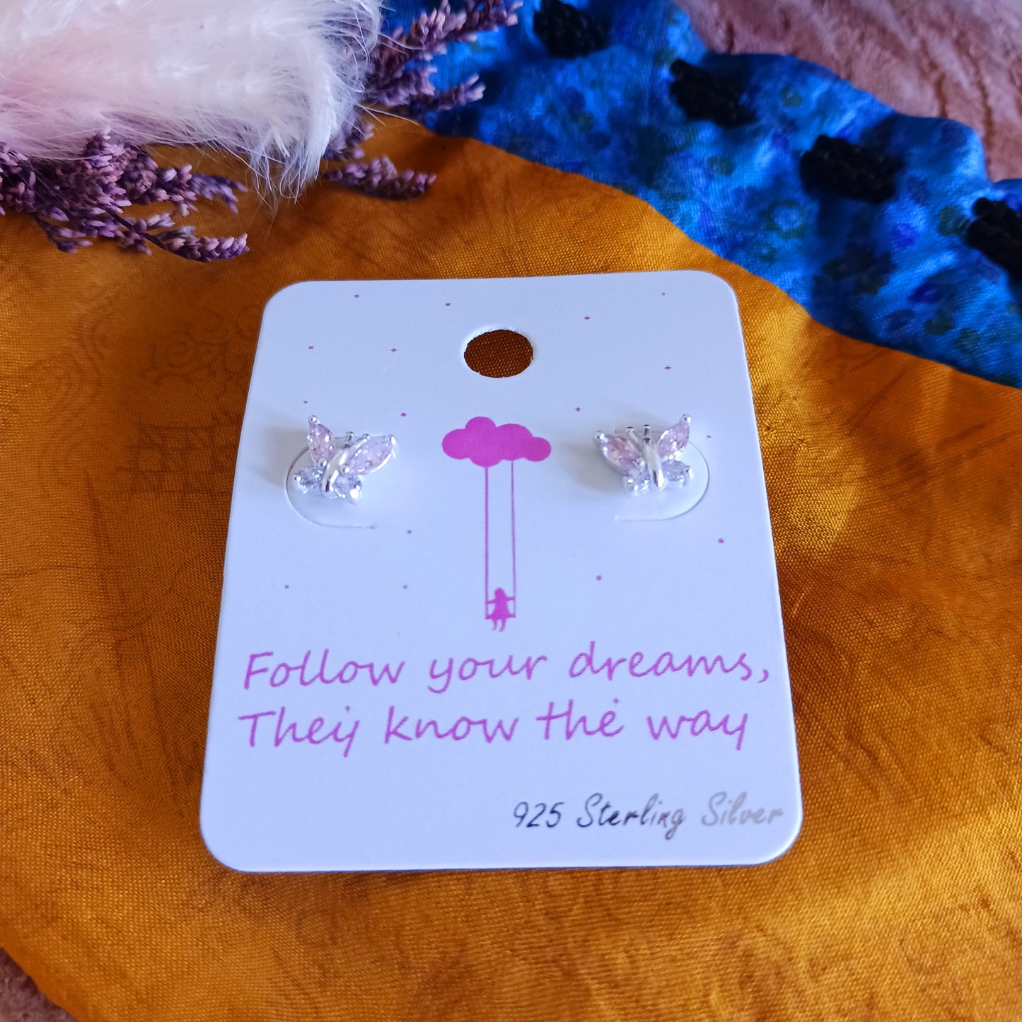 These pretty little butterfly stud earrings are 925 sterling silver, decorated with 8 cubic zirconia stones and part coloured in a baby pink pastel shade. These cute and delicate earrings are a perfect gift for family and loved ones.