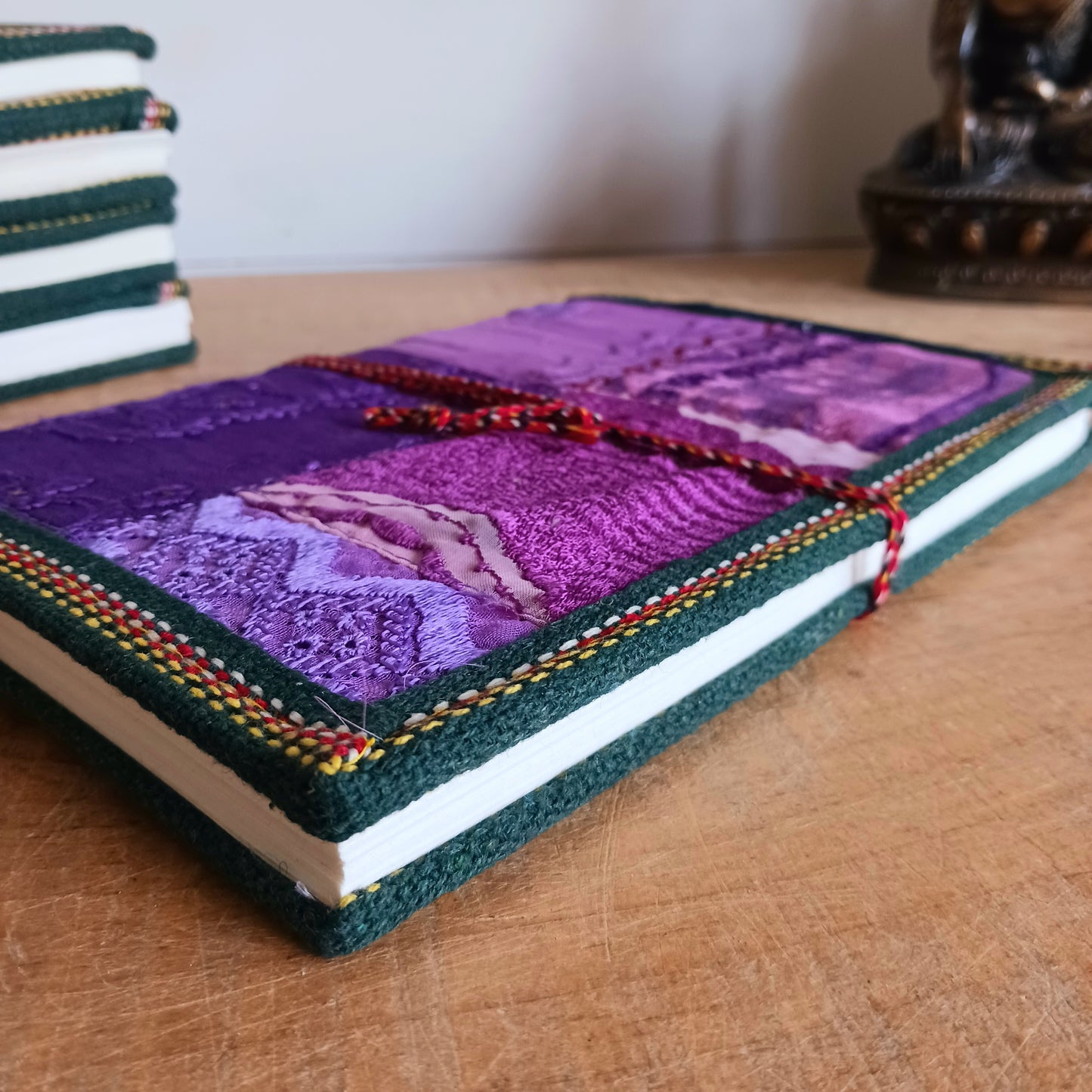 This beautifully bound notebook with handmade paper is from recycled cotton. An imaginative use for sari offcut material, the cover is edged and framed with pretty brocade material to complete a lovely and unique eco friendly stationery gift.