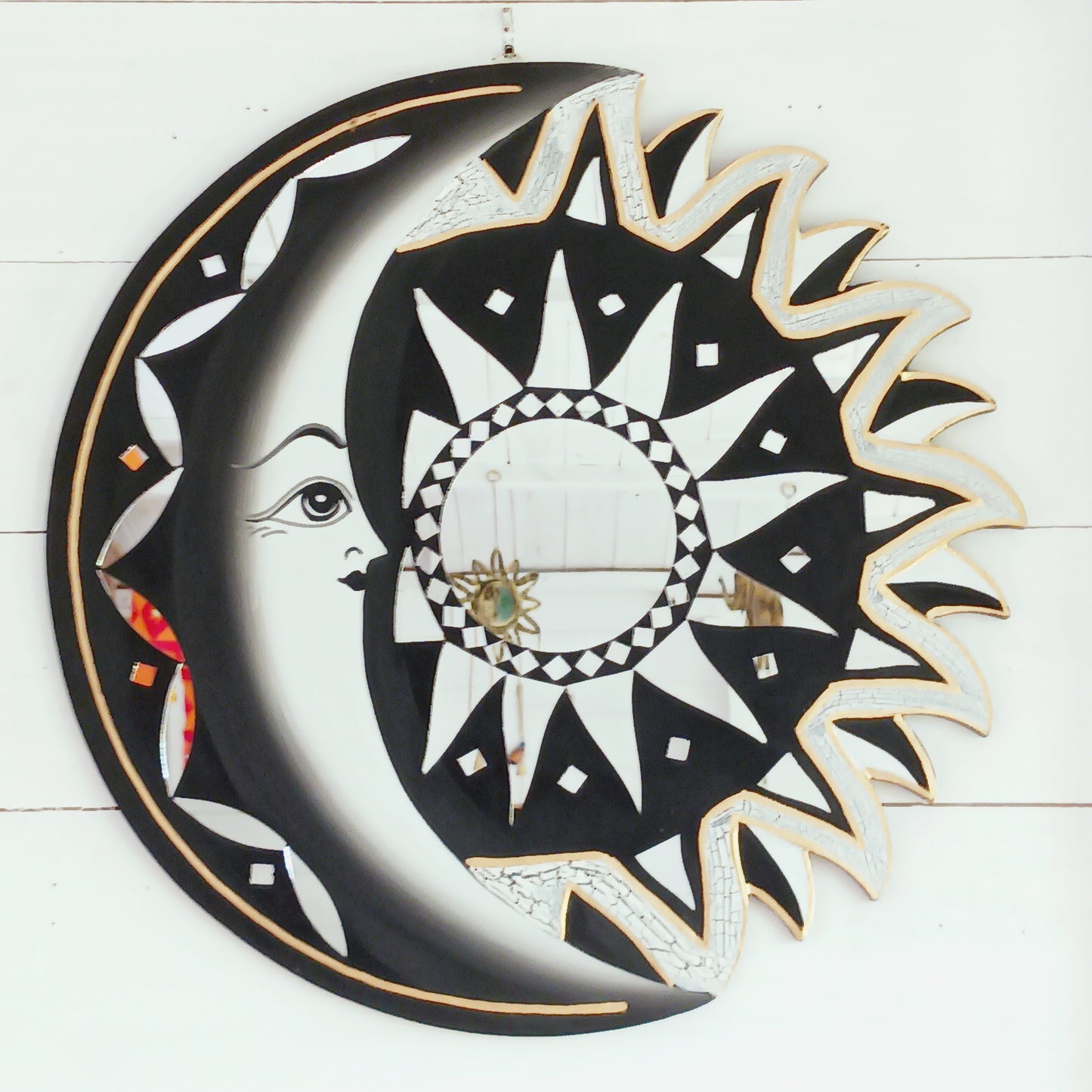 Bring the power of the sun and moon into your home with this stunning mirror. This unique eco-friendly piece allows you to express your spiritual side and add a vibrant touch to any space with silver hues echoing the brightness of solar and lunar energy. It's quirky, eclectic and great for a fresh bit of decor.