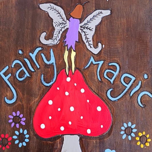 Bring a touch of enchantment to your home with this Fairy Magic Handmade Wall Plaque. Beautifully crafted and hand-painted, it features a delightful fairy resting among whimsical mushrooms, perfect for adding charm and colour to any space. Whether displayed indoors or outdoors, this rustic fairy wall art will brighten your surroundings and spark a little magic every day.