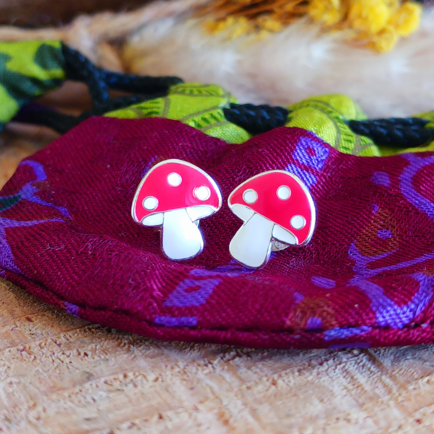 These colourful Mushroom 925 Sterling Silver Ear Studs are the perfect accessory for any outfit. Crafted from 925 sterling silver, they feature a stylish 9mm x 10mm mushroom design and come presented in a beautiful recycled sari gift pouch.