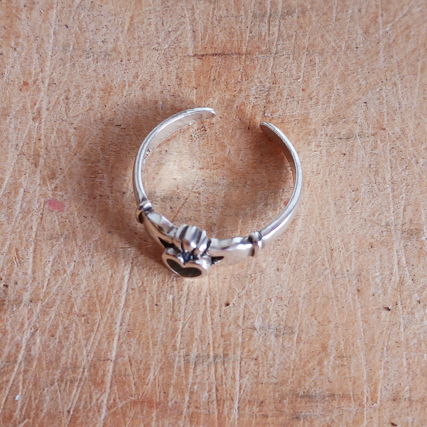 This beautifully made sterling silver toe ring is designed with Black Onyx gemstone. The Irish Claddagh ring, means Love, Loyalty and Friendship, and features a heart (love), crown (loyalty), and two hands (friendship).