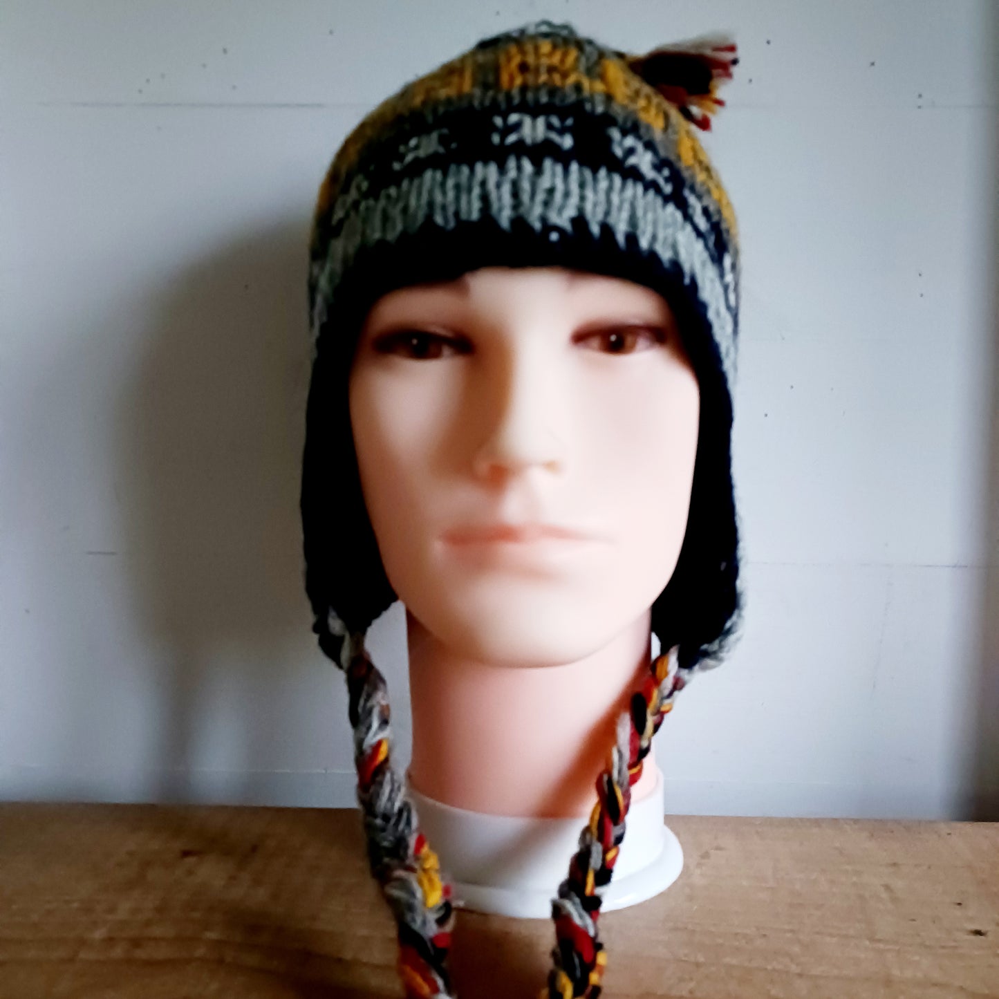 Stay cozy and stylish with our handmade chunky wool earflap hats, crafted in Nepal by skilled women artisans in Kathmandu. Each hat is 100% pure wool and features a soft polar fleece lining for extra warmth and comfort. Perfect for cold winter days, outdoor adventures, or adding a touch of handmade charm to your look.