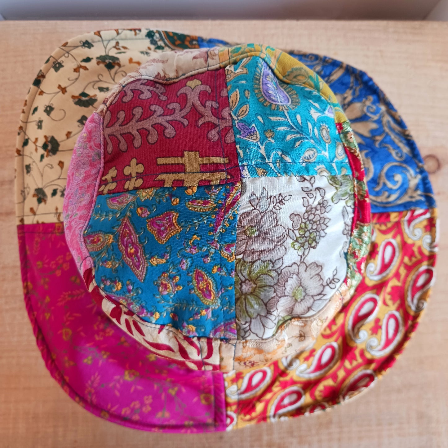 A swell little number for festivals and summer times, you'll look the coolest in this recycled sari patchwork sun hat. Black polyester lined, with a slightly flexible brim for adjusting the shape.