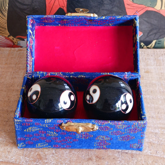 Boost hand flexibility and focus with Chinese Health Balls. Includes 2 chime balls in a silk brocade box. Ideal for relaxation, therapy, and energy balance.
