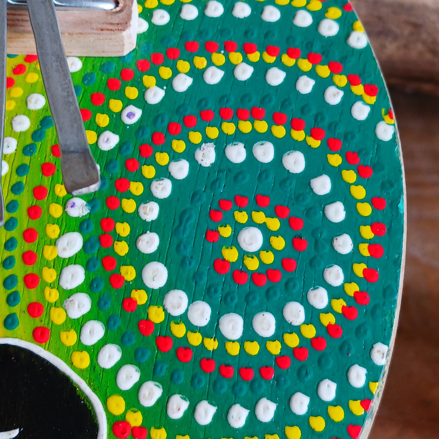 This thumb piano has been hand carved out of coconut shell and decorated with vibrant colour dot painting of an elephant. The piano board itself has been placed over a polished half coconut, which creates a resonating chamber that produces a louder, more harmonically complex sound. It has 7 keys which are adjustable and easy to tune by tightening or loosening the screws on the top.