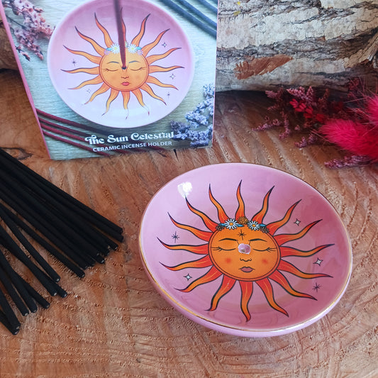 This modern incense stick holder features a lovely warm colourful sun design inspired by 'The Sun' tarot card. This ceramic dish provides a stylish and practical way to enjoy incense.