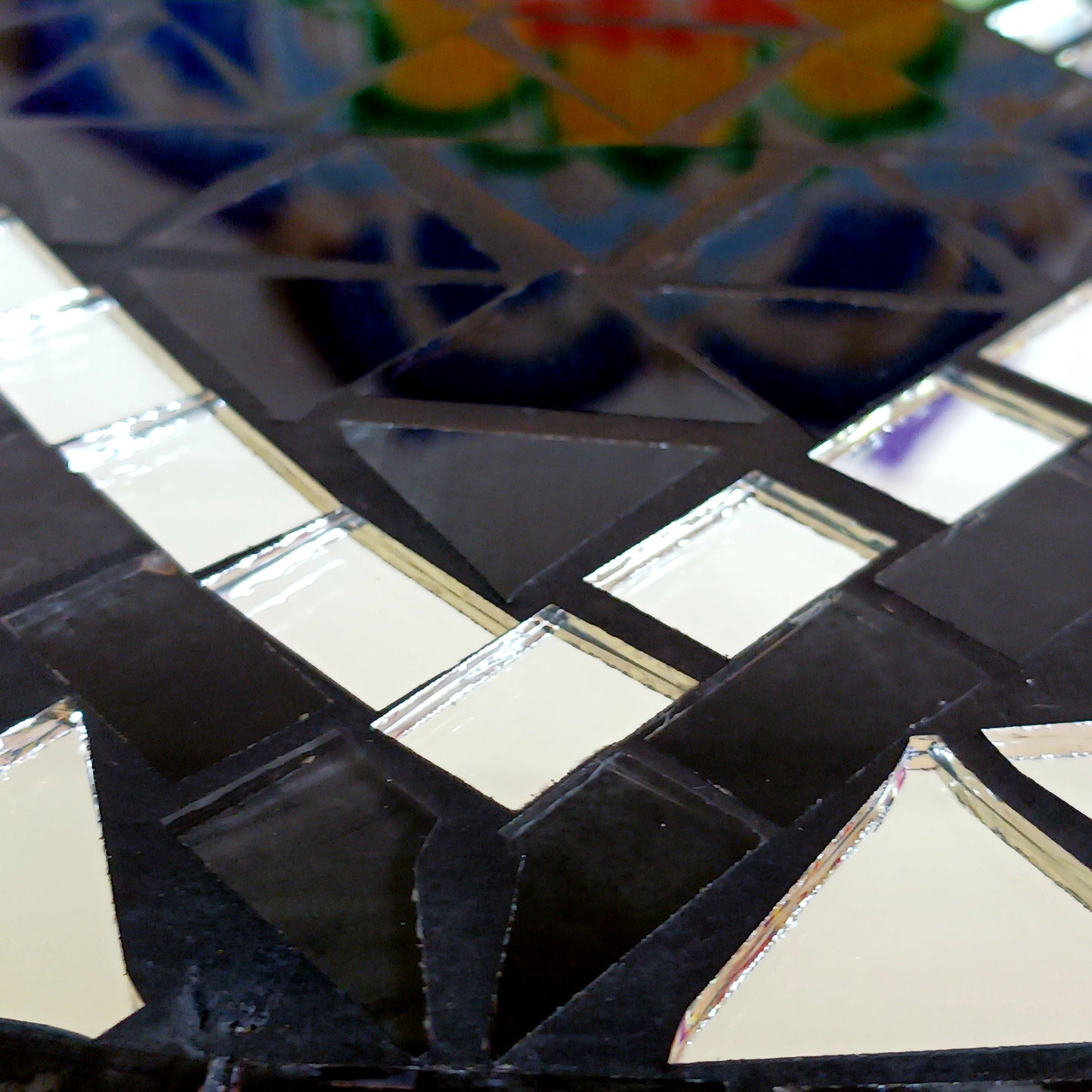 Bring balance, energy, and harmony to your space with this large handcrafted Mosaic Yin and Yang Wall Plaque. Each plaque is carefully created using small glass pieces, meticulously arranged to form a striking black and silver yin and yang design. The reflective mosaic catches the light beautifully, adding depth and elegance to any room.
