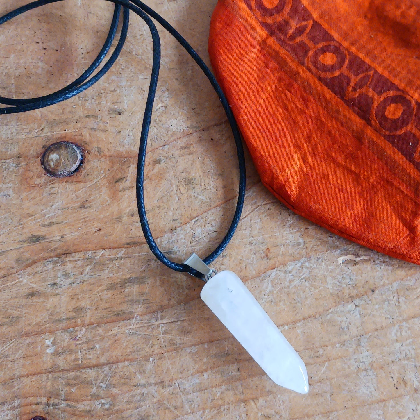 Embrace the natural power of rock crystal with this elegant pendant on a sleek black cord necklace. Known as a master healing stone, rock crystal energises the body, purifies the aura, and enhances inner strength.