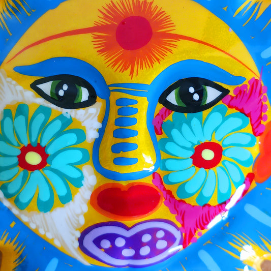 Bring a burst of colour and joy into your space with this sunny, vibrant wall plaque! Expertly hand-painted in the bold, traditional style of Xalitla, Guerrero, Mexico, this decorative piece radiates cultural charm. The vivid colors and striking glaze add depth and personality, making it a standout feature in any room. With two convenient holes for easy hanging, it’s ready to brighten your home with authentic folk art flair.
