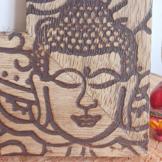 Made in India from sustainably sourced mango wood, these lovely picture frames bring warmth, character, and meaning to any space. Each one is carefully carved or painted with spiritual and cultural designs that go beyond decoration holding deep symbolism and tradition. The small Buddha in the corner is a peaceful presence that represents wisdom and enlightenment. Ideal for meditation spaces, yoga studios, or anyone seeking a sense of calm.