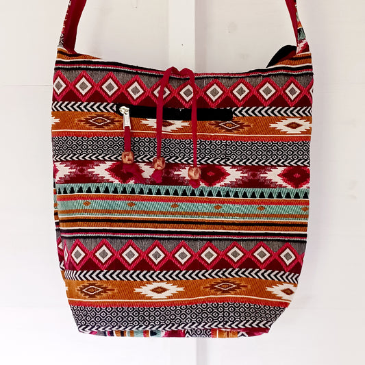 Bring vibrant artisan style to your everyday adventures with this Jacquard Nepal Sling Bag. Designed in a traditional Nepal-inspired jacquard pattern, this beautifully crafted bag is the ideal size for carrying all your personal belongings comfortably.