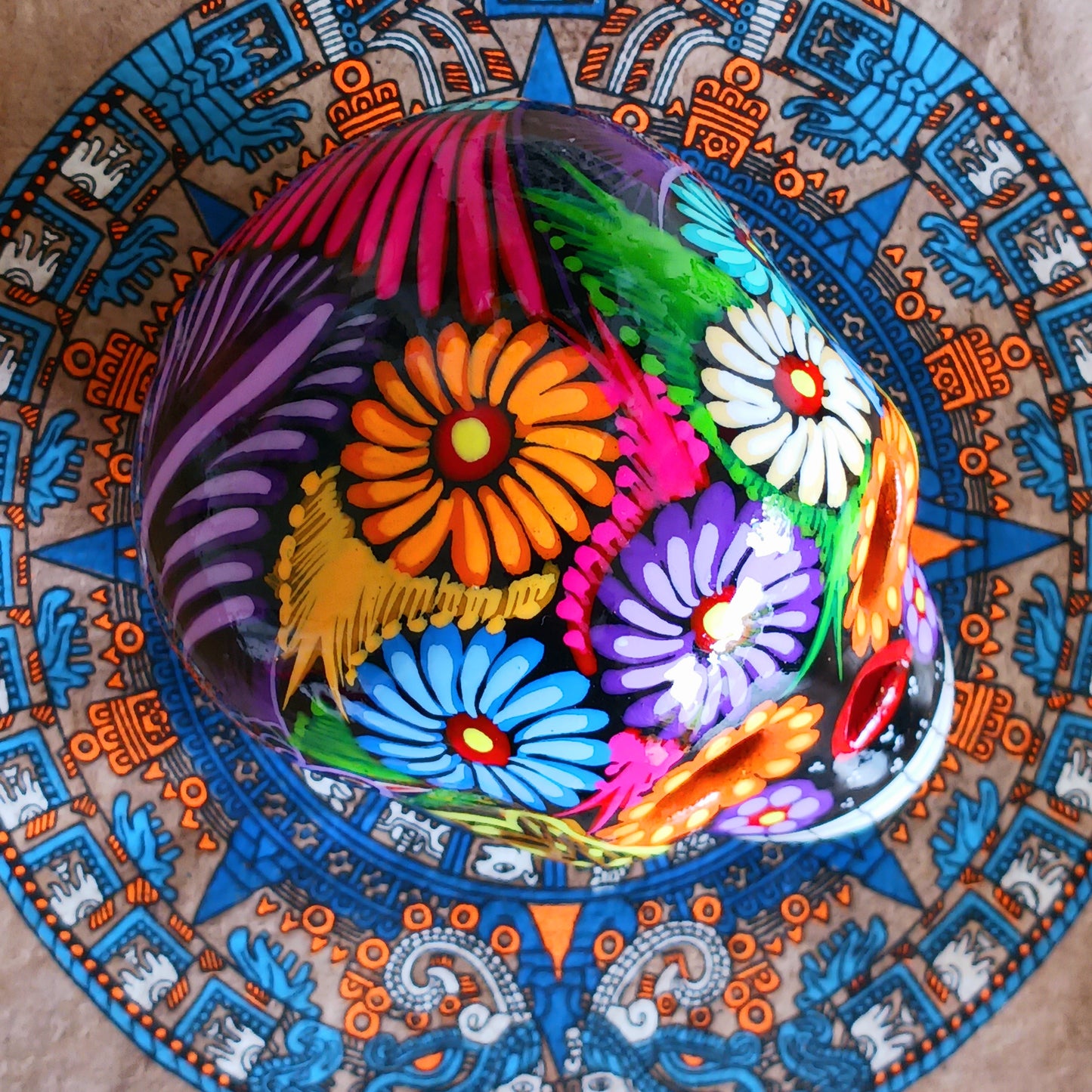 These fun ceramic sugar skull ornaments have been beautifully painted in bright colours and finished with a high shine glaze. They are a popular item during Día de Los Muertos or Day of the Dead festivities, held in Mexico every November to celebrate welcoming the souls of their deceased relatives back for a time of food, drink and celebration.
