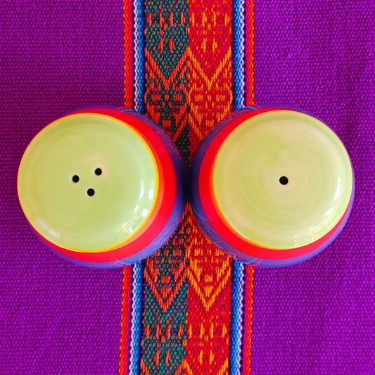 Bring a burst of colour to your dining table with this delightful rainbow stripe ceramic salt and pepper set. Each piece is hand-painted, making every set unique and full of character. The vibrant stripes add a cheerful touch to any home, combining functionality with artistic flair.