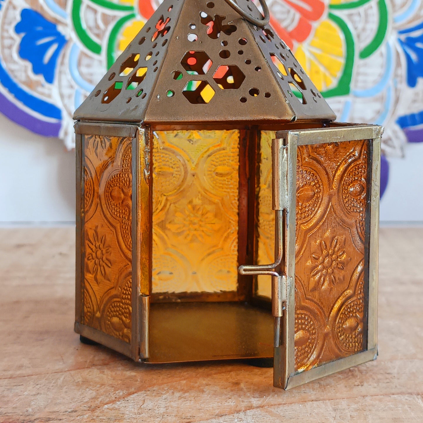 This cute little tealight lantern has honeycomb and bee cut outs crafted into the antique brass coloured metal. Open the small hinged door to add a tealight and close with the sliding latch. A super gift idea for gardeners and nature lovers. Ideal as indoor table centrepieces and summer table decorations for garden parties and eating alfresco. Light to provide a comforting indoor glow on darker days.