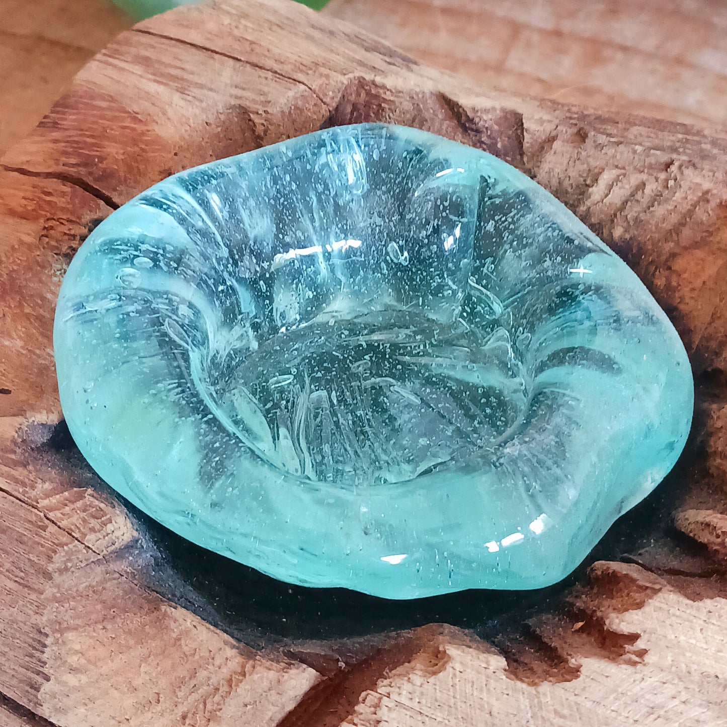 Bring nature into your home with this stunning handmade melted glass candle holder crafted in Bali. Each piece is truly one-of-a-kind, made from recycled glass hand-blown over whitewashed Balinese Gamal wood. As the molten glass cools, it moulds perfectly to the shape of the natural wood root, creating a unique balance of earthy and chic design.