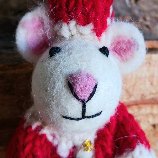 Meet our endearing little Christmas mice, dressed in vibrant Santa knitwear, donning a classic Santa outfit ready to spread festive cheer. Each ornament is lovingly handcrafted, capturing the magic and childlike wonder of the holiday season.