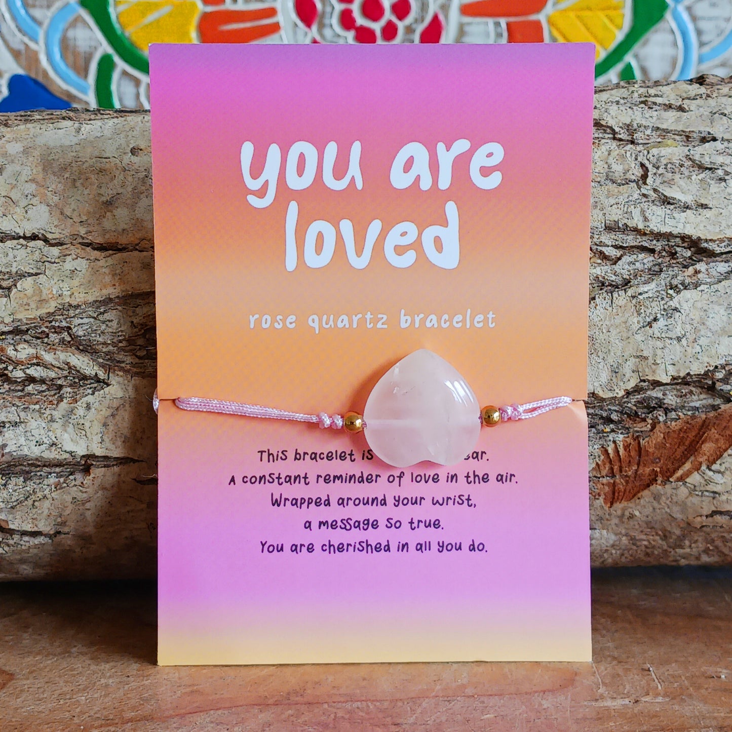 Give the gift of love with this rose quartz crystal heart bracelet. Comes with a “You are loved” card and poem—perfect for someone special.
